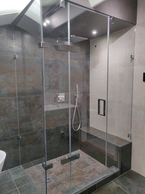 Shower enclosures for complicated spaces