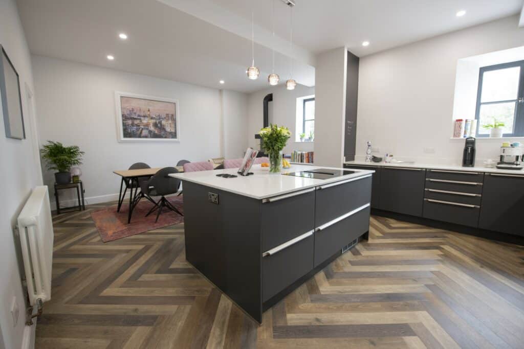 Kitchen with island and rustic style floor