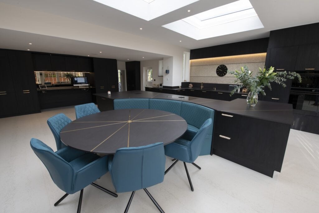 Kitchen photo. Black and brass theme. Designed, supplied and installed by Roots
