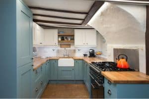 photo of a Roots designed and installed kitchen in a listed building with a low beamed ceiling